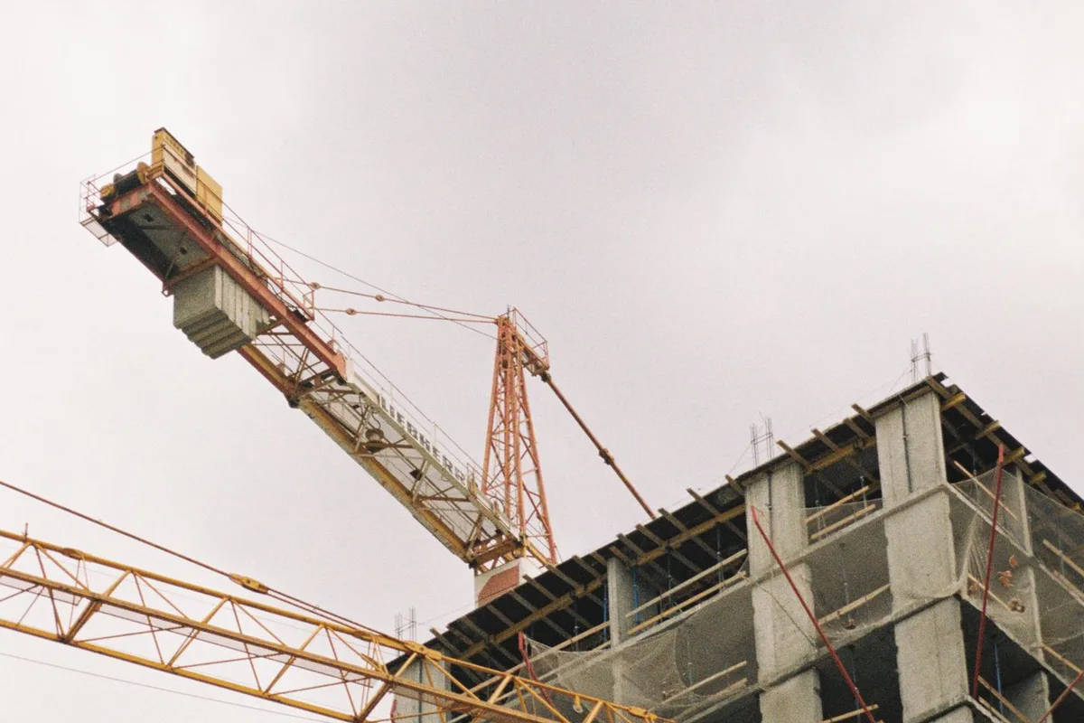 Tower cranes over a building under construction